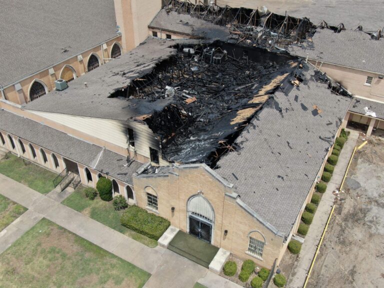 Aerial photograph of church property after a fire loss