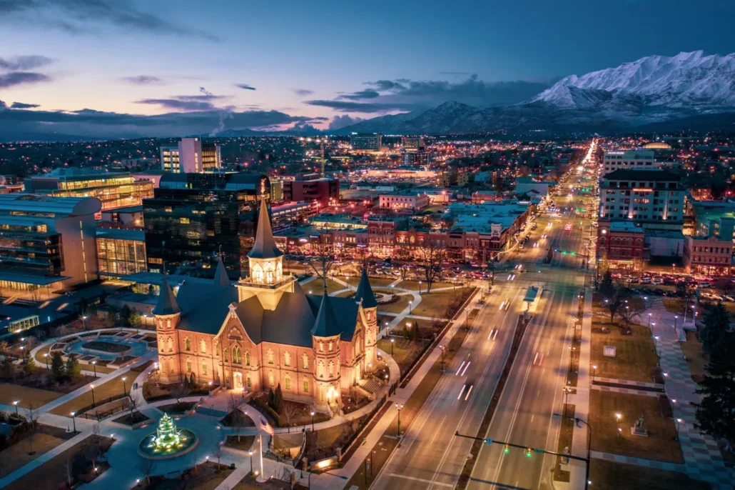 Downtown Provo at dusk with snow-covered mountains